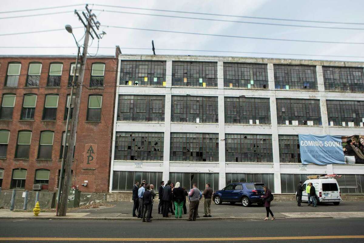 The long vacant Farrel Process Lab with its white facade is one of five downtown Ansonia buildings a developer plans to turn into a retail and residential complex called Bella Vista.