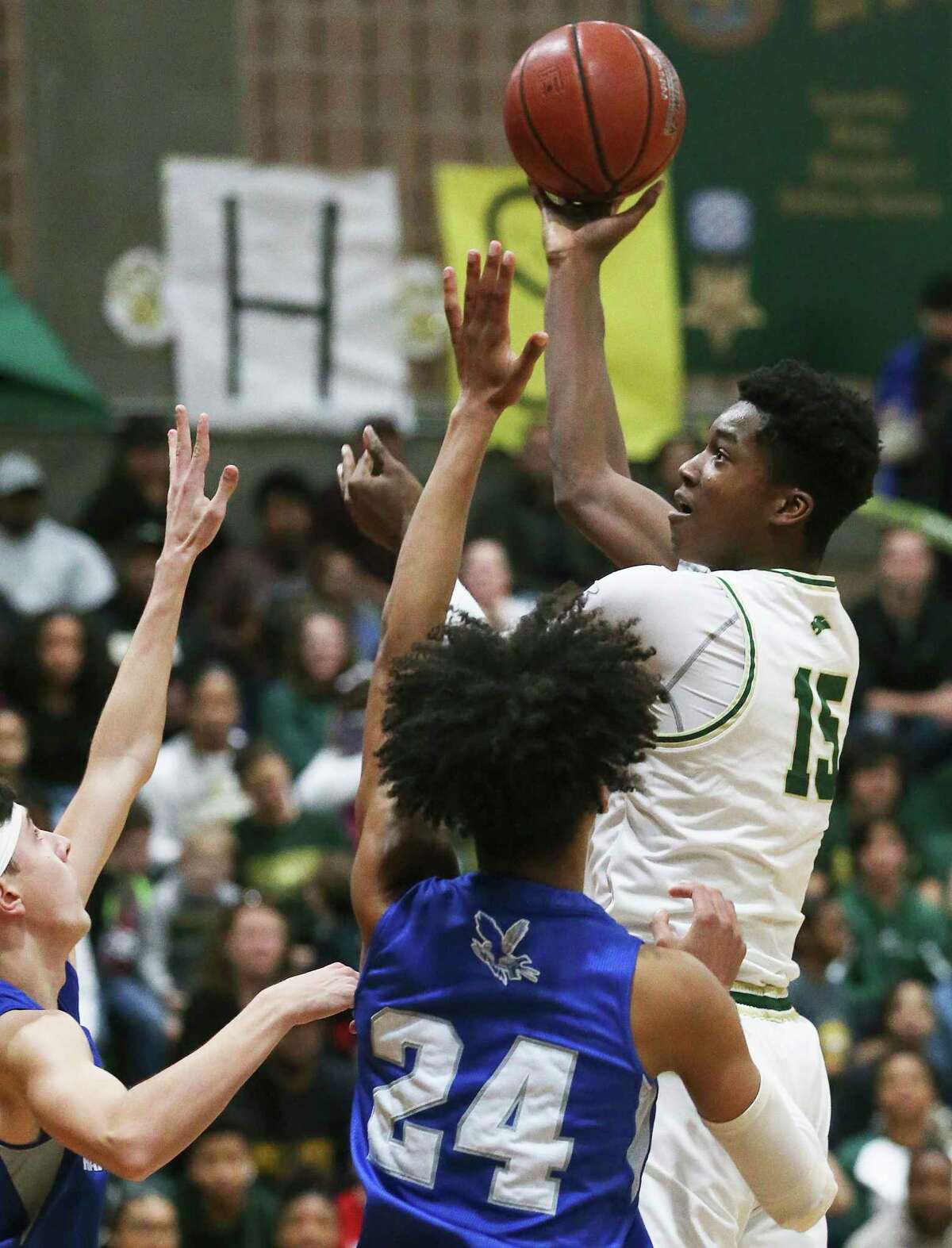 Cole’s Vincent Iwuchukwu puts up a soft hook in the first half against Randolph in a District 26-3A opener Friday.