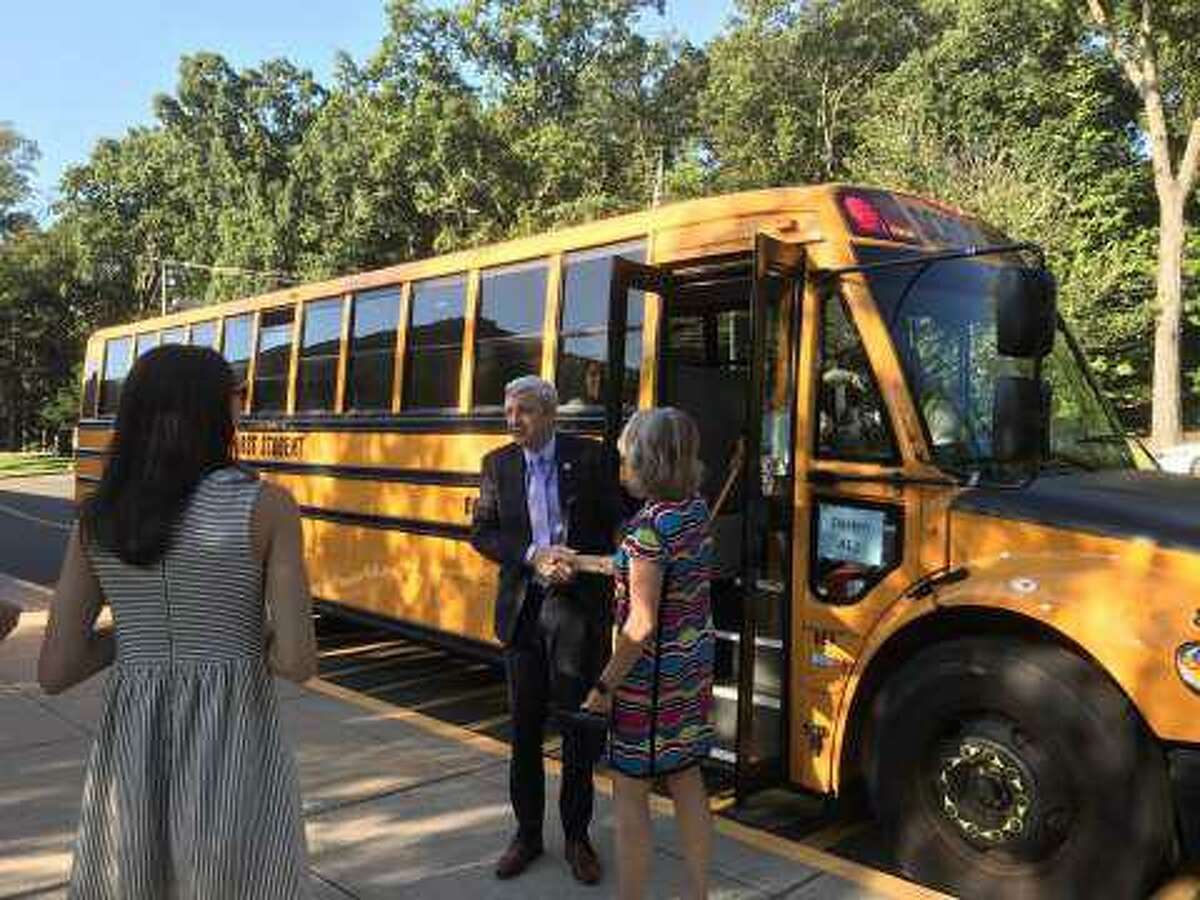 Dr. Alan Addley greeted Tokeneke School staff on the first day of school in 2019 after taking the bus with kindergaretners.