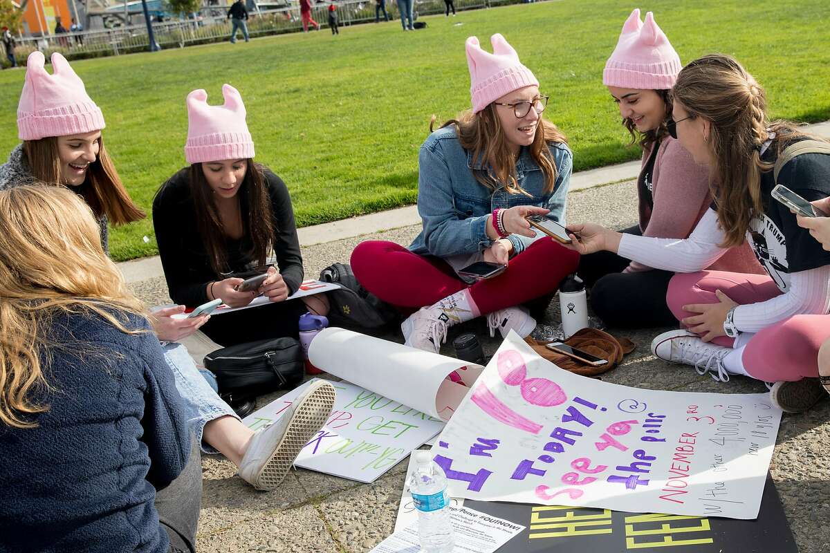 A group of friends from Pleasanton sports pink cat ear hats as they gather at Civic Center Plaza during a rally before the start of the 4th annual Women's March held in San Francisco, Calif. Saturday, Jan. 18, 2020.