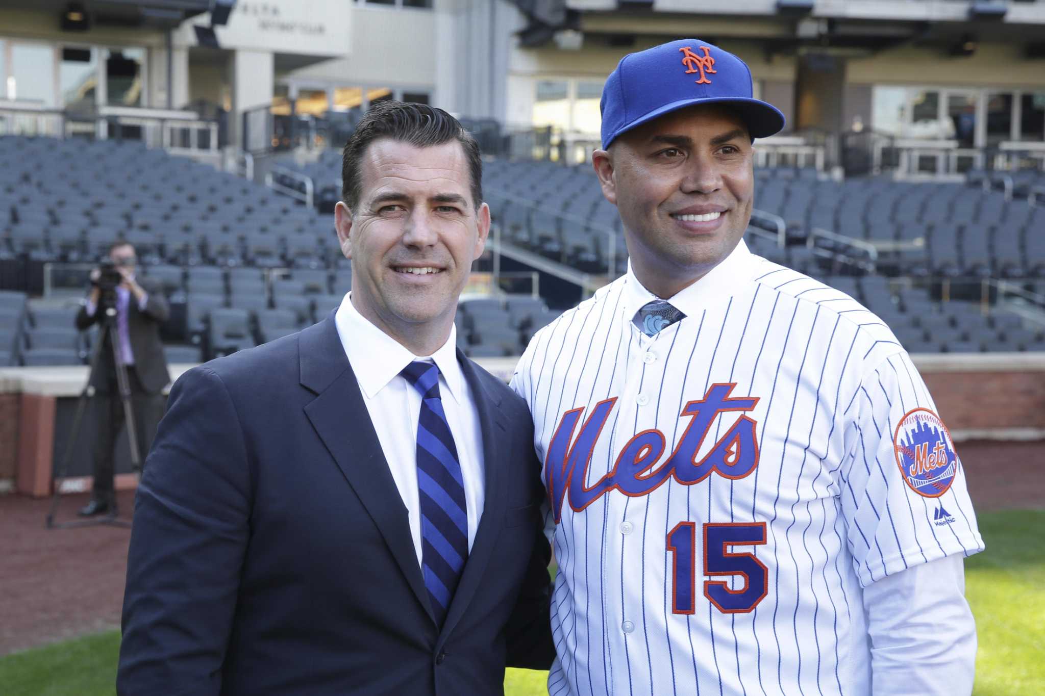 Carlos Beltran poses for photographers in Shea Stadium following a