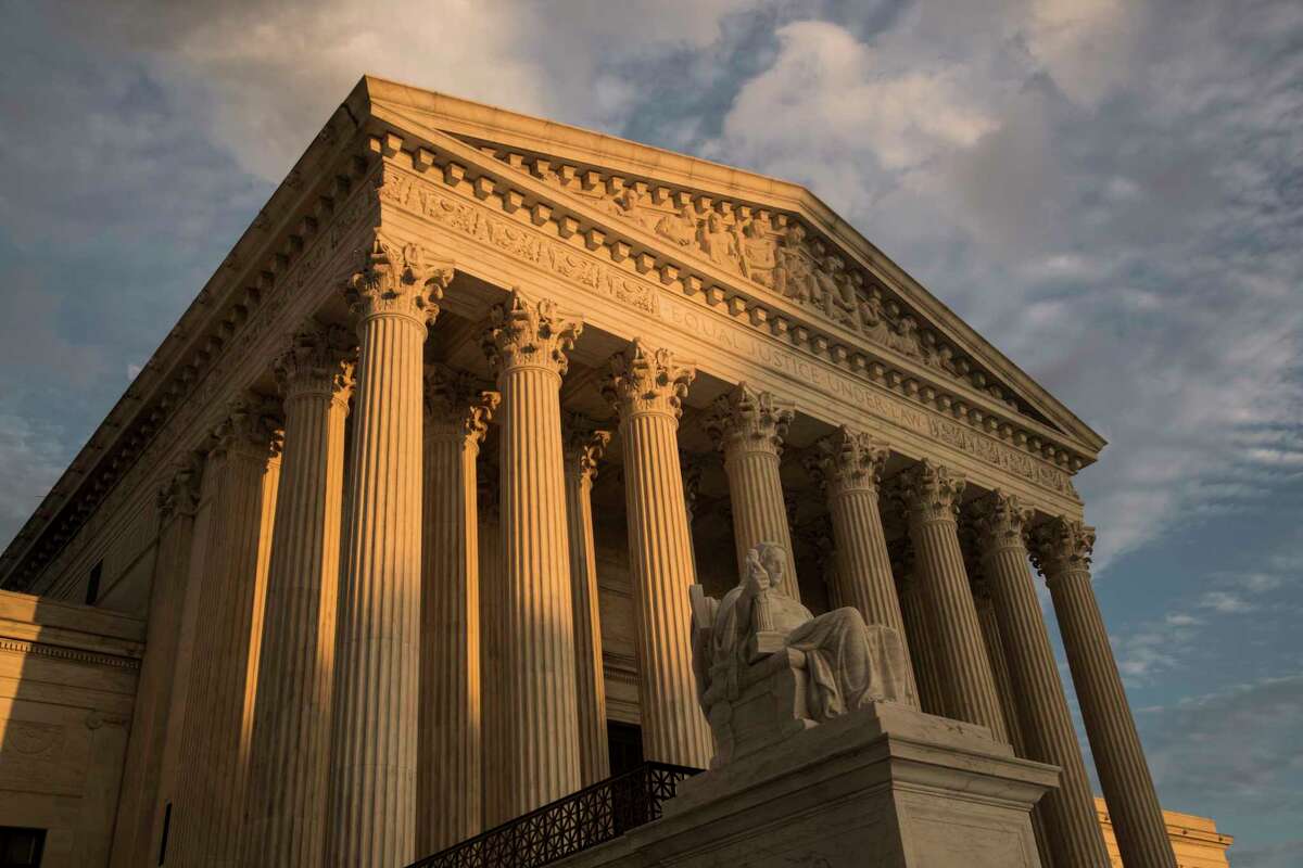 FILE - In this Oct. 10, 2017, file photo, the Supreme Court in Washington, at sunset. A Supreme Court that seems more favorable to religion-based discrimination claims is set to hear a case that could make it easier to use public money to pay for religious schooling in many states. (AP Photo/J. Scott Applewhite, File)