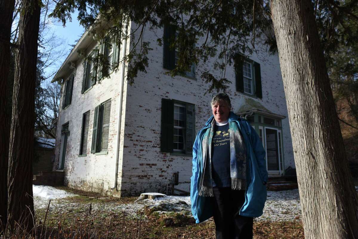 Debi Craig, immediate past president of the Washington County Historical Society and member of the Greenwich Easton Historical Association, stands outside Susan B. Anthony's early childhood home on Friday, Jan. 17, 2020, on State Route 29 in Battenville, N.Y. Several local history groups have been trying to entice the state to renovate this historic home, but so far to no avail. (Will Waldron/Times Union)