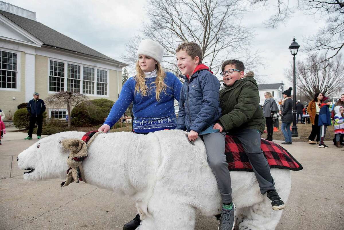 Nick Sposato and Ryan Ciannello ride a polar bear at last year's Winter Carnival. Safari Rides and Photos of Wallingford will be back again for this year's carnival on Sunday, Jan. 26, in Wilton Center.