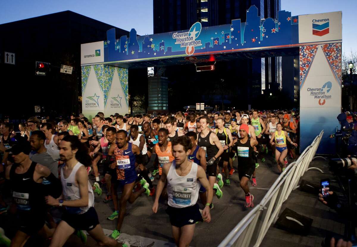 Runners take off from the starting line of the 48th running of the Chevron Houston Marathon Sunday, Jan. 19, 2020, in Houston.