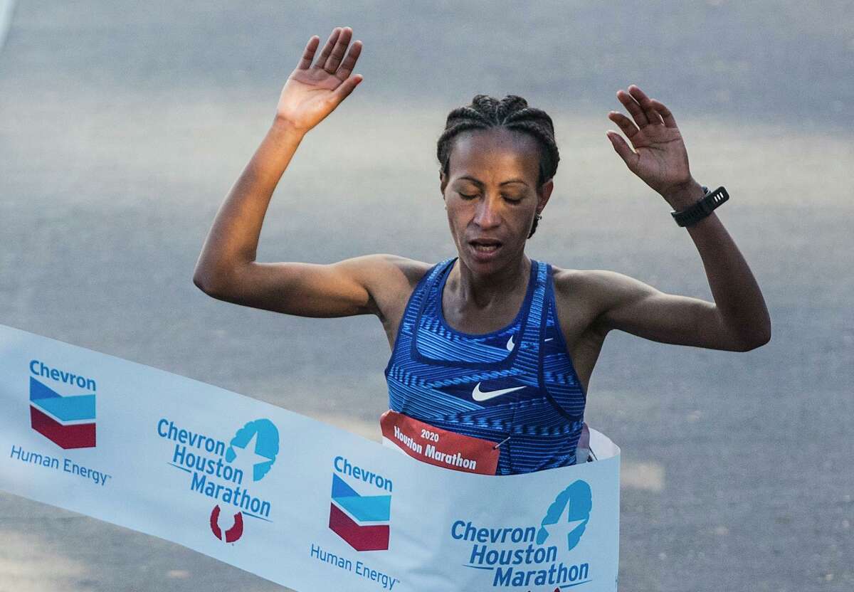 Ethiopia’s Askale Merachi breaks the tape to win the women's race in the 48th running of the Houston Marathon.