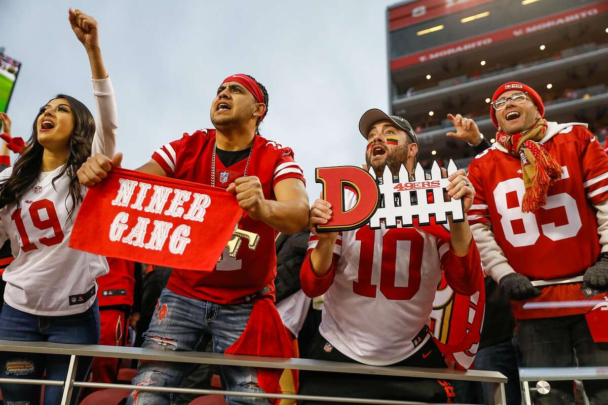 (L-r) Brianna Ruiz, Cesar Ruiz and Matt Bridges cheer during the final minute of the first half of the NFC Championship game between the San Francisco 49ers and the Green Bay Packers at Levi�s Stadium on Sunday, Jan. 19, 2020 in Santa Clara, California.