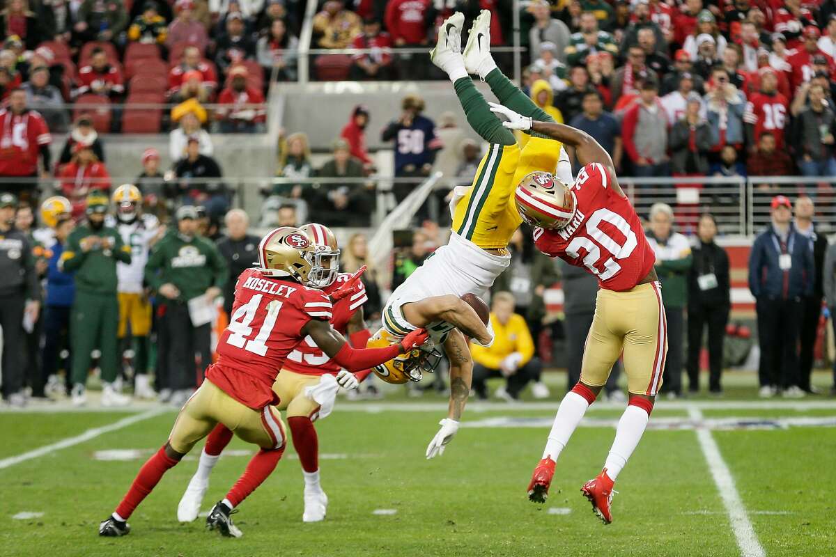 San Francisco 49ers wide receiver Richie James (13) avoids a tackle attempt  by Green Bay Packers wide receiver Allen Lazard (13) during the NFL  football NFC Championship game, Sunday, Jan. 19, 2020