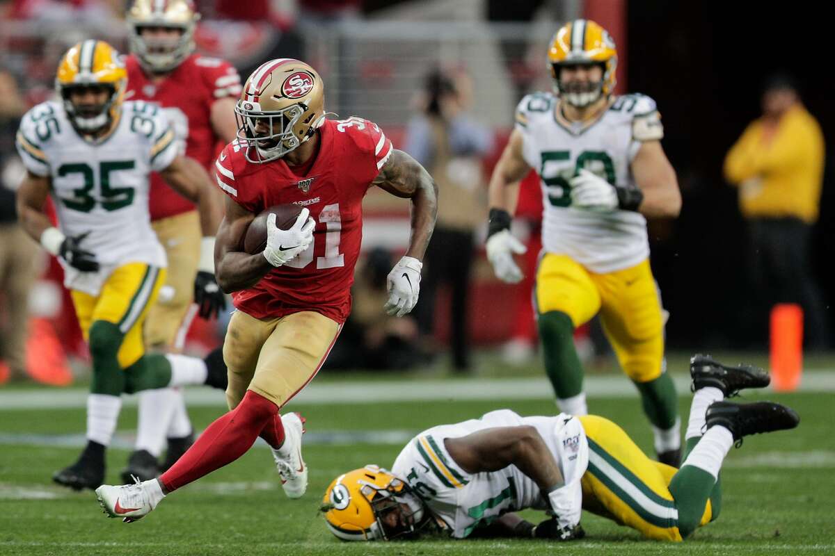 San Francisco 49ers’ Raheem Mostert runs for a gain in the second quarter during the NFC Championship game between the San Francisco 49ers and the Green Bay Packers at Levi’s Stadium on Sunday, Jan. 19, 2020 in Santa Clara, Calif.