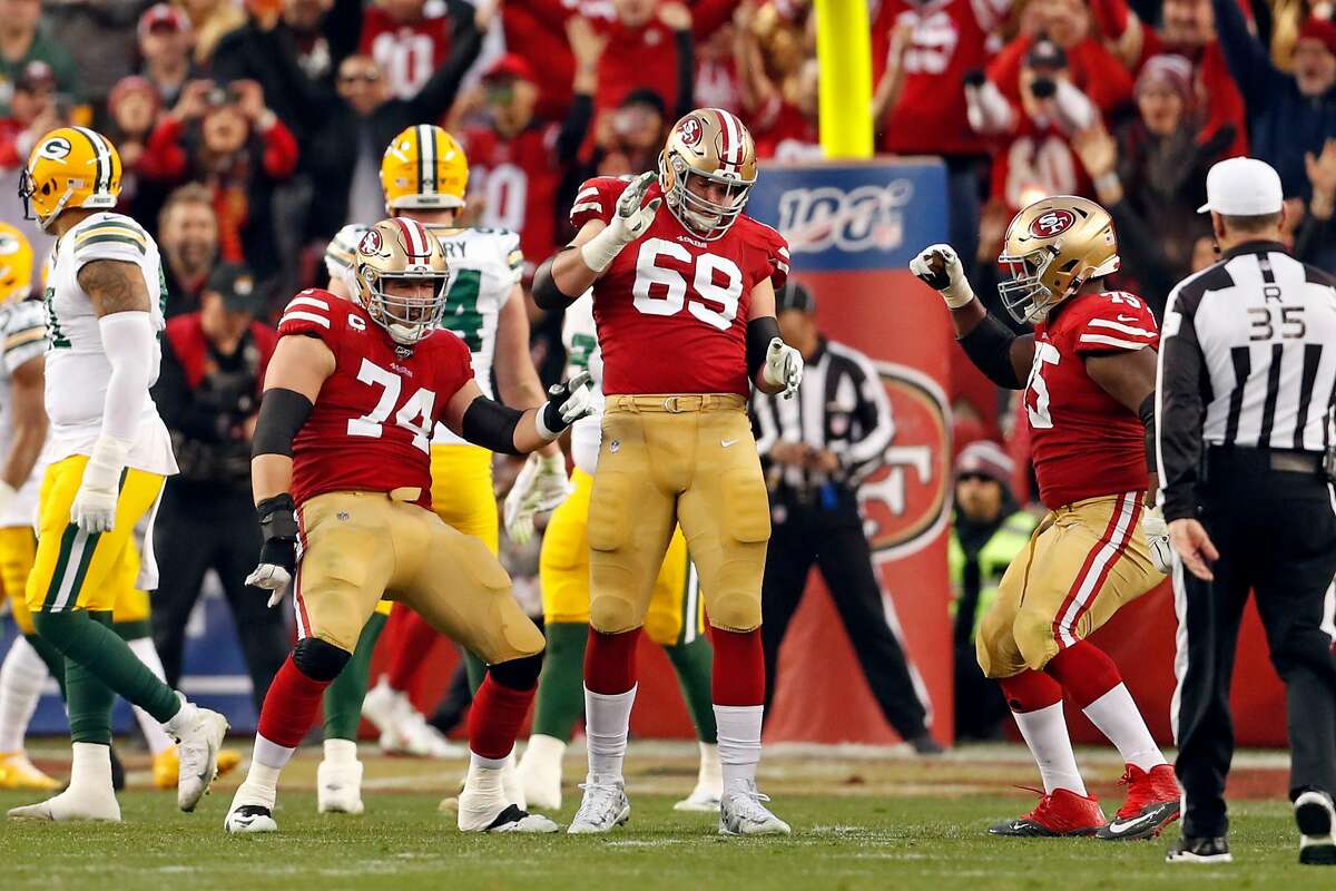 San Francisco 49ers' Joe Staley, Mike McGlinchey and Laken Tomlinson dance after Raheem Mostert's 3rd touchdown of the game during 37-20 win over Green Bay Packers during NFC Championship Game at Levi's Stadium in Santa Clara, Calif., on Sunday, January 19, 2020.