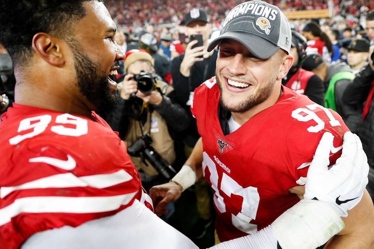 San Francisco 49ers’ DeForest Buckner and Nick Bosa celebrate the 49er 37 to 20 victory over the Green Bay Packers in the NFC Championship game at Levi’s Stadium on Sunday, Jan. 19, 2020 in Santa Clara, Calif.