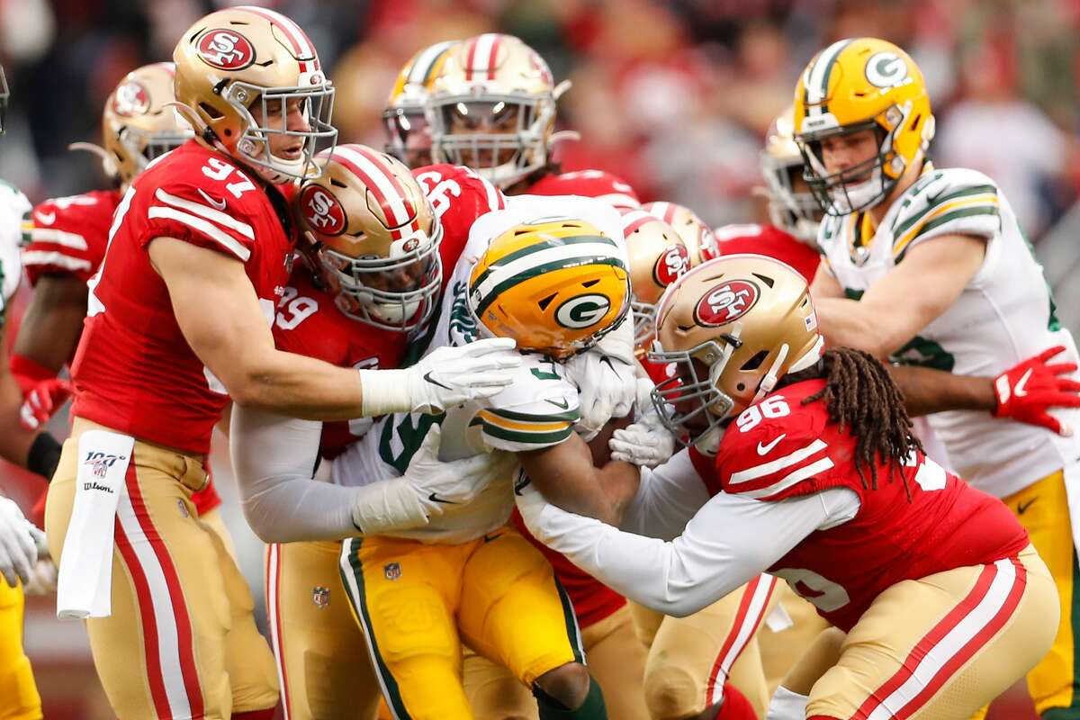 Miami Gardens, Florida, USA. 2nd Feb, 2020. San Francisco 49ers defensive  tackle DeForest Buckner (99) comforts San Francisco 49ers defensive end  Nick Bosa (97) after the Chiefs beat the 49ers 31-20 in