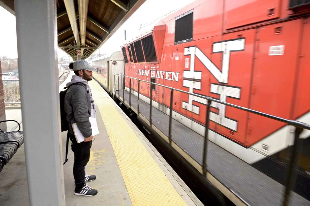 Justin Alam, a student at Western Connecticut State University, waits for a Metro North train at the Danbury train station. Mayor Mark Boughton wants to restart the old Maybrook Line train line that runs from the Danbury train station to the Southeast station in New York State, allowing riders to travel to New York in less time on the Harlem Line. Tuesday, April 9, 2019, in Danbury, Conn.