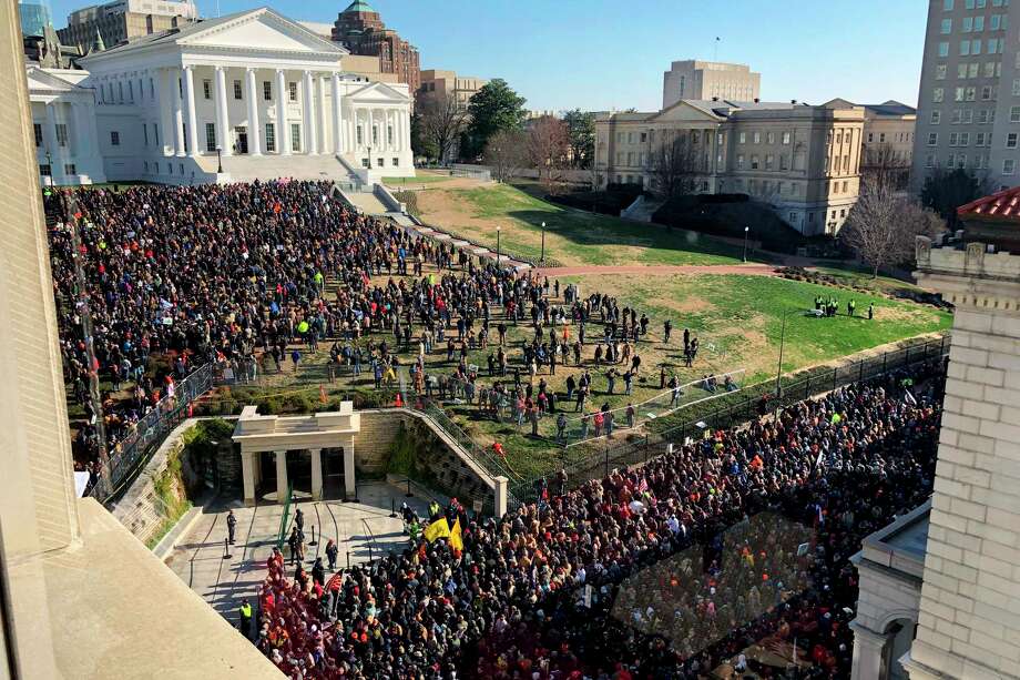 Demonstrators are seen during a pro-gun rally, Monday, Jan. 20, 2020, in Richmond, Va. Thousands of pro-gun supporters are expected at the rally to oppose gun control legislation like universal background checks that are being pushed by the newly elected Democratic legislature. Photo: Sarah Rankin, AP / Copyright 2020 The Associated Press. All rights reserved