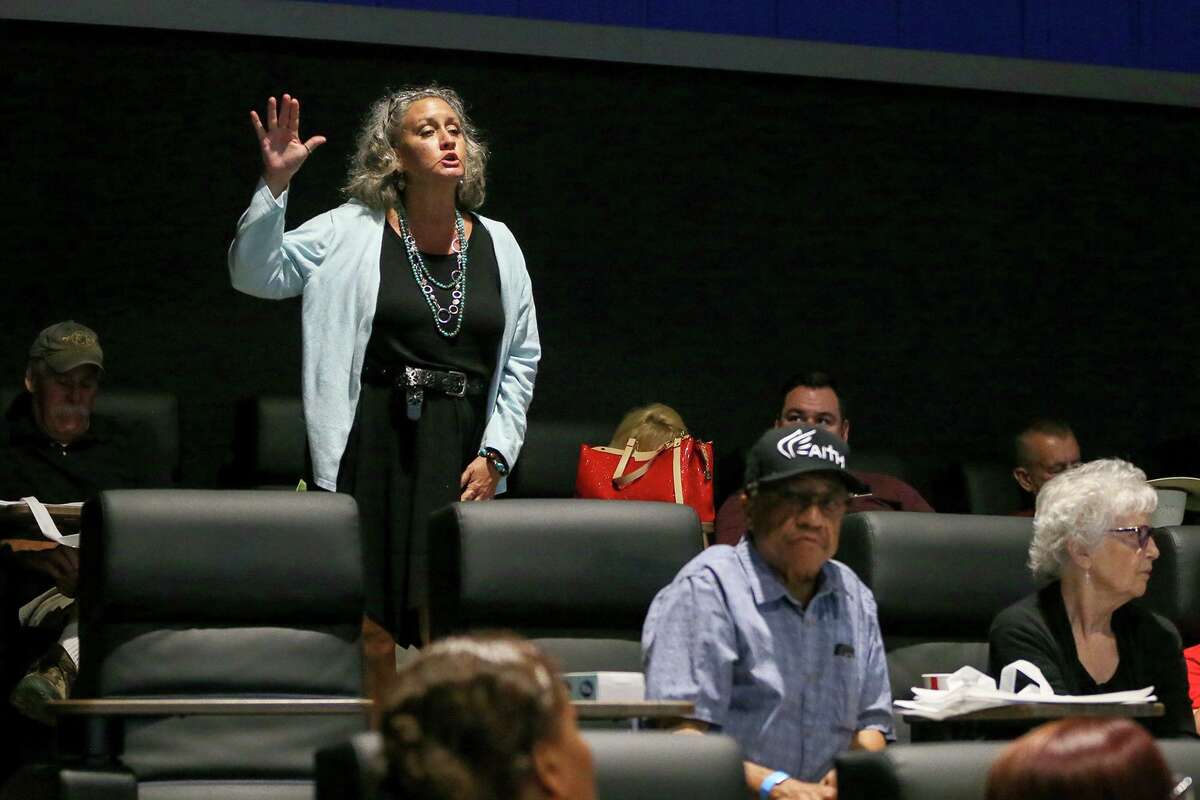 Kara Latimer, standing, asks a question about the proposed Cibolo toll road project during a town hall meeting held June 5, 2019. Cibolo City Council earlier this month unanimously approved ending an agreement with the road’s developer.