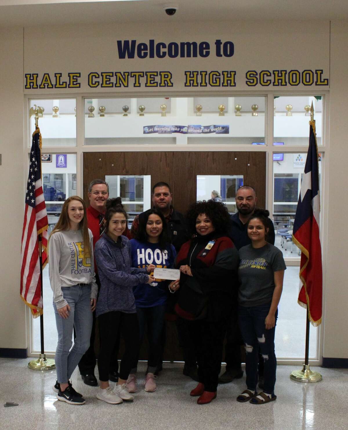 Members of the Walmart Transportation team in Plainview present a $2,000 donation to Hale Center ISD on Jan. 15. The funds were collected through the company’s Miles For Education fundraiser. Pictured: (front row) Katy Huffhines, Avery Aleman, Vanessa Calderon, general transportation manager Tonya Morris, and Jessica Rodriguez; (back row) Hale Center High School principal Carlon Branson, Walmart shop operations manager Matthew Lopez, safety operations manager Troy Valdivia