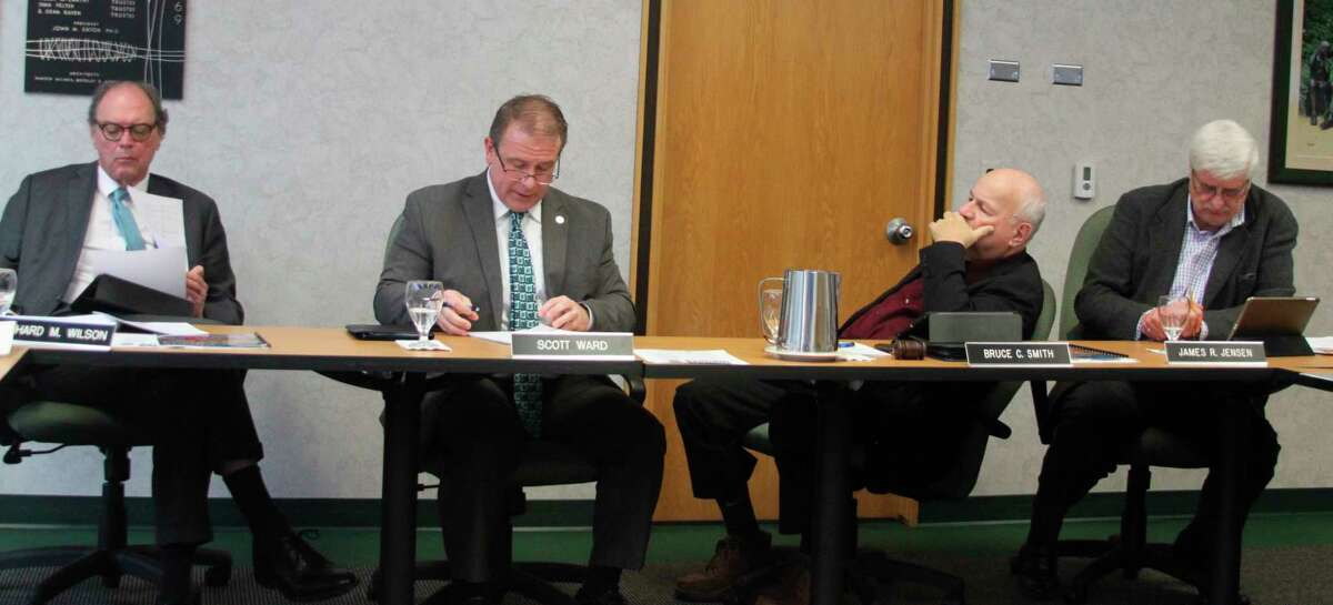 West Shore Community College president Scott Ward (second from left) explains to the WSCC Board of Trustees about the decision to recommend The Christman Company of Grand Rapids as the project manager for the Downtown Manistee Education Center. (Ken Grabowski/News Advocate)