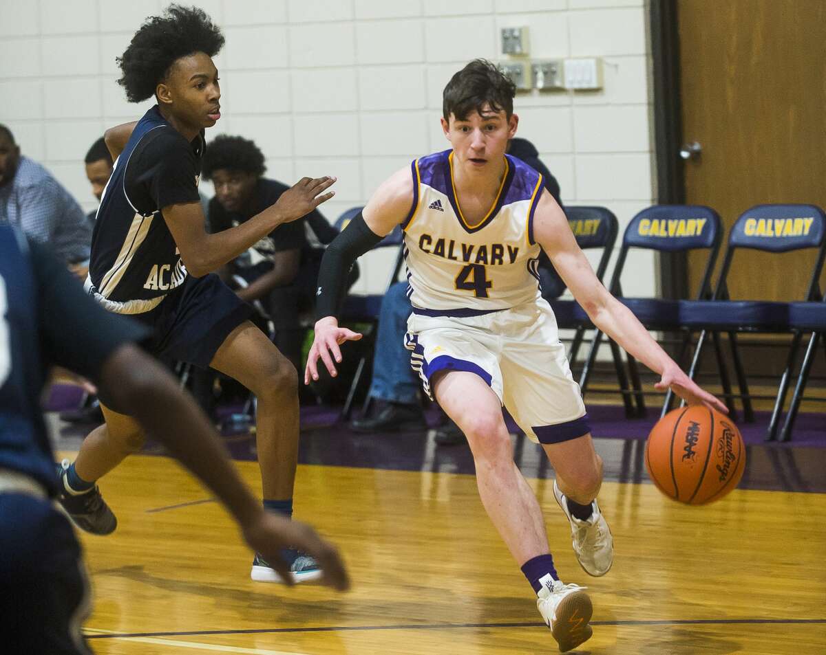 Calvary Baptist's Nate Wiggins dribbles down the court during a game against Madison Academy Monday, Jan. 20, 2020 at Calvary Baptist Academy. (Katy Kildee/kkildee@mdn.net)