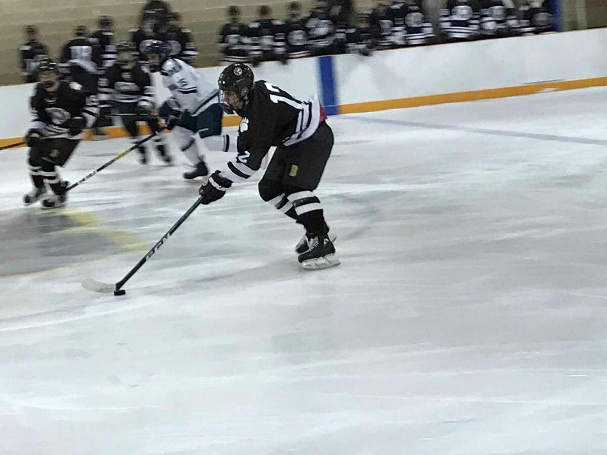 Brunswick senior defenseman Shayan Farjam moves the puck up the ice during the Bruins’ 3-1 win vs. Millbrook School on Monday, January 20, 2020. A captain, Farjam is one of the Bruins’ top defenseman.