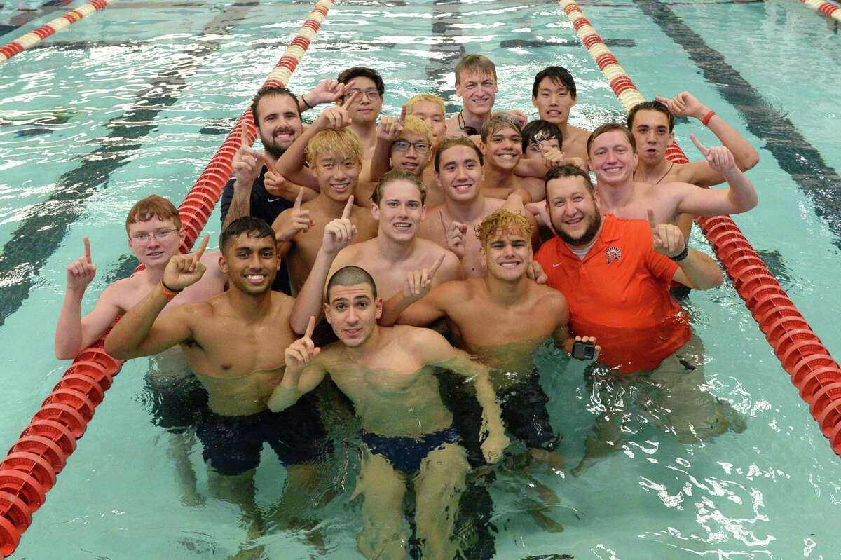 The Seven Lakes Spartan Boys team celebrates their first place finish at the District 19-6A Swimming and Diving Championships on January 18, 2020 at the Katy HS Natatorium, Katy, TX.