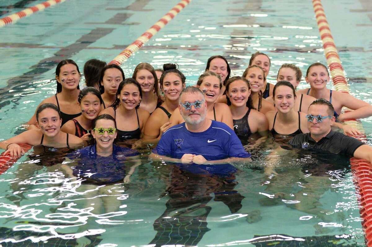 The Taylor Mustang Girls team celebrates their first place finish at the District 19-6A Swimming and Diving Championships on January 18, 2020 at the Katy HS Natatorium, Katy, TX.