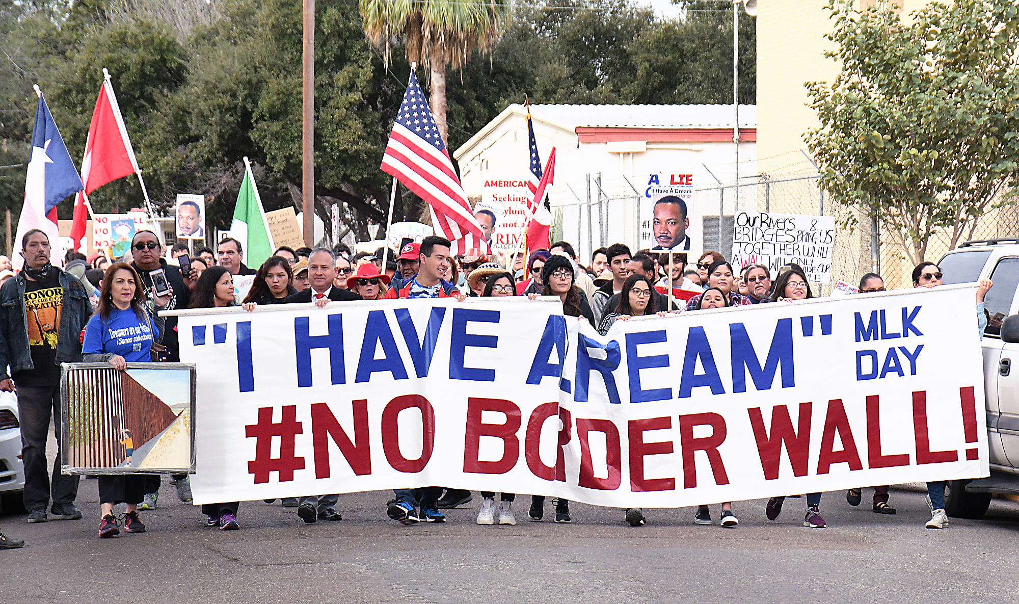 Hundreds of locals march against border wall on MLK Day