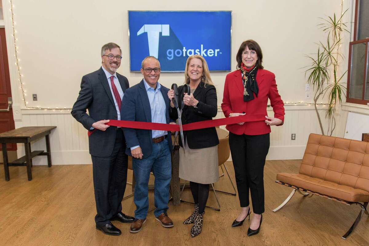 Cutting the ribbon, from left, are Mark Barnhart, Fairfield Community and Economic Development Director; goTasker owner Frank Festini; First Selectwoman Brenda Kupchick; and Beverly Balaz, Fairfield Chamber of Commerce president.