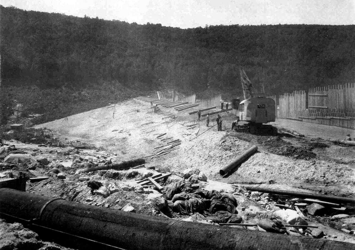 A handout historical photo from CL&P dated Aug. 15, 1927 of the construction of the dam at the north end of what was to be Candlewood Lake. In the foreground is the pipe to be used to pump water from the Housatonic River into the lake from the Rocky River power-generating station along Route 7 in New Milford. If you have a