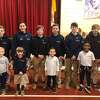 Holy Trinity Catholic Academy held its eighth grade pin ceremony Thursday, Jan. 16. Pictured are (back, left to right) Alex Balko, Tatiana Bell, Jacob Bisset, Matthew Conelius, Nicolas Coppola and Brady Grinvalsky with their kindergarten buddies (front, left to right) Jordan, Molly, Mason, Matai and Abby.