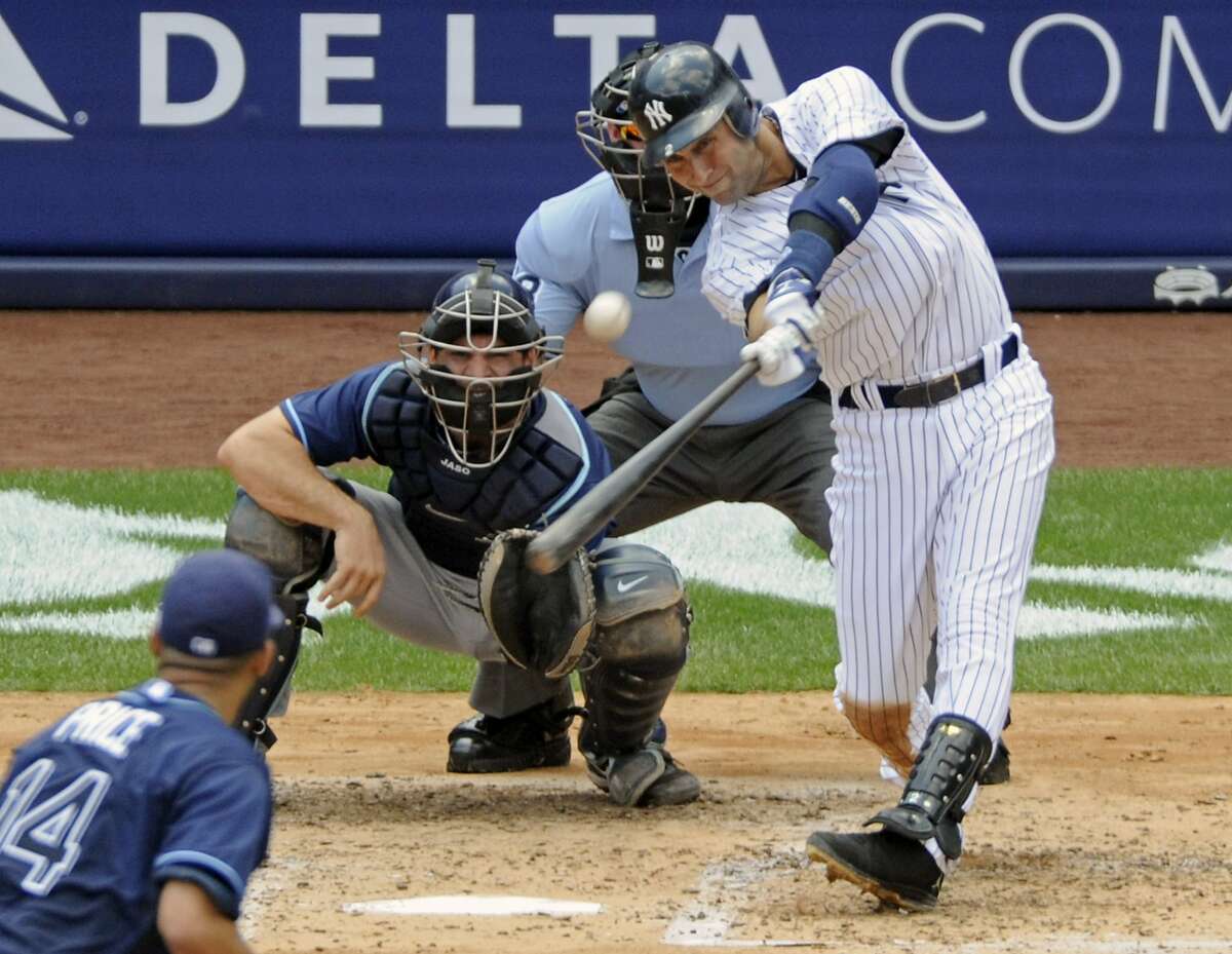 In this July 9, 2011, file photo, New York Yankees' Derek Jeter hits a home run for his 3,000th career hit during the third inning of a baseball game against the Tampa Bay Rays at Yankee Stadium in New York. Back in 1994, Jeter hit .377 with 12 stolen bases in 34 games with the Albany-Colonie Yankees. Click on the link to see some of his career highlights. https://www.youtube.com/watch?v=2xHpevdVa1U (AP Photo/Bill Kostroun, File)