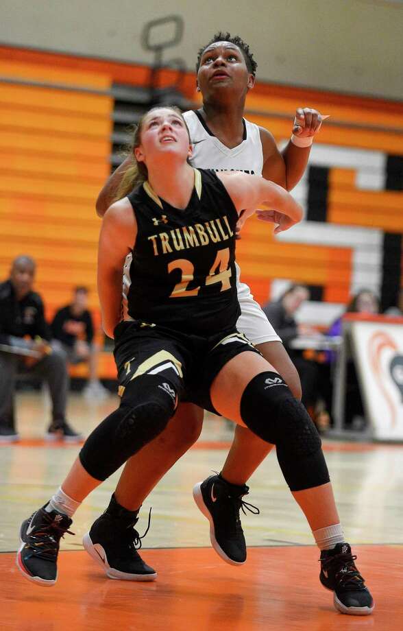 Trumbull's Cassi Barbato (24) battles for position with Stamford Emily Graham (21) in the second half of an FCIAC girls basketball game on Jan. 21, 2020 in Stamford, Connecticut. Trumbull defeated Stamford 46-41. Photo: Matthew Brown / Hearst Connecticut Media / Stamford Advocate