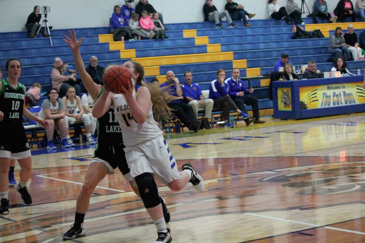Evart's Madison Parrish goes to the basket against Houghton Lake. (Herald Review photo/John Raffel)