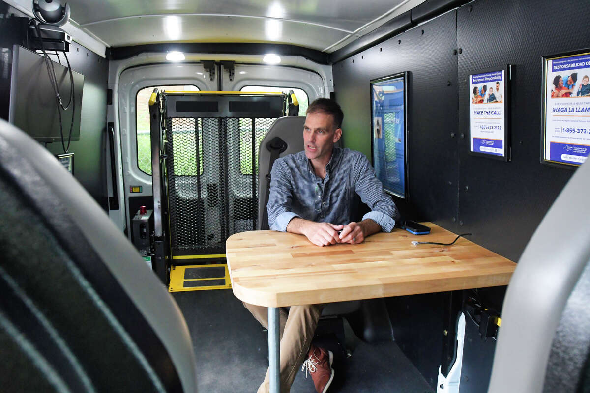 Chad Putman, project director of the Center for Treatment Innovation Project at New Choices Recovery Center, sits in the mobile treatment van on Tuesday, Aug. 27, 2019, in Schenectady, N.Y. (Paul Buckowski/Times Union)