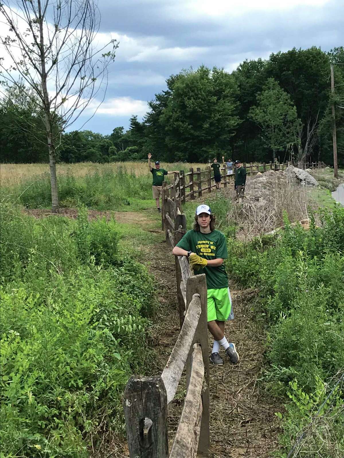 Owen Weber at the fence he and other volunteers installed at an Audubon Society property in Westport.