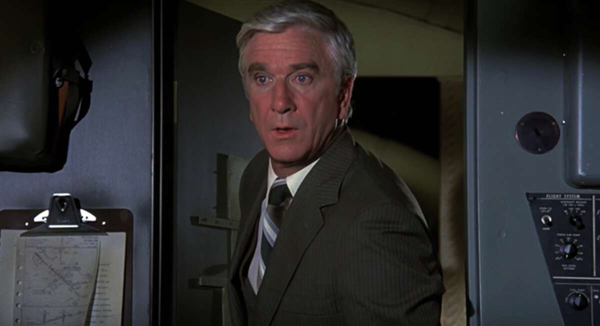 Leslie Nielsen Leslie Nielsen embodies the spirit of “Airplane!” playing the straight-faced Dr. Rumack, whose literal interpretations of every line of dialogue serve as the perfect foil for the other goofball characters.