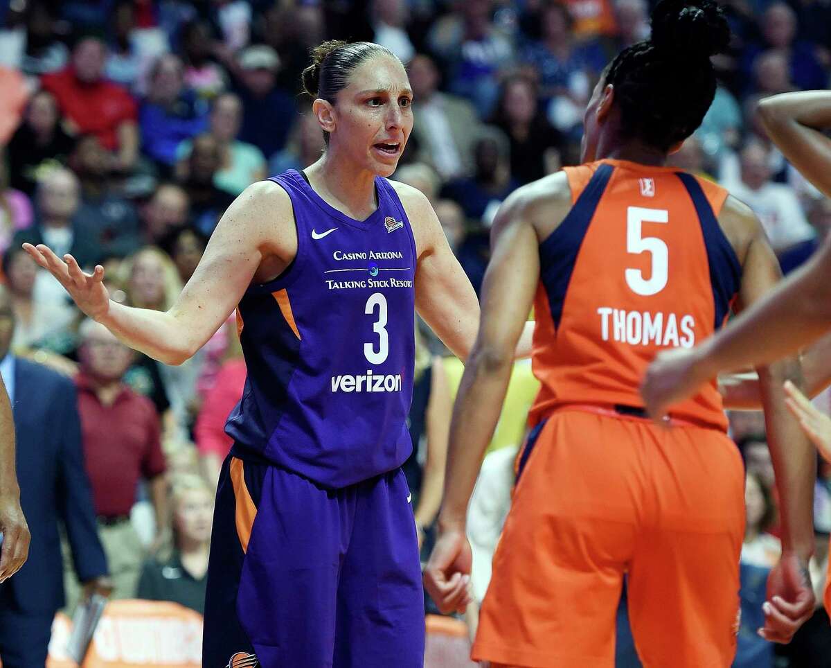 Connecticut Sun guard Jasmine Thomas (5) confronts Phoenix Mercury guard Diana Taurasi after being fouled during the first half of a single-elimination WNBA basketball playoff game Thursday, Aug. 23, 2018, in Uncasville.