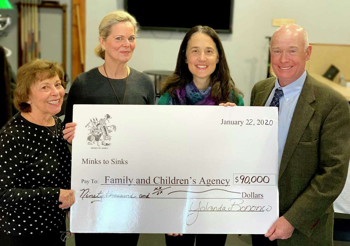 Members of Minks to Sinks in Wilton present a check representing the organization's annual contribution to Family & Children's Agency of Norwalk on Jan. 22. From left are Rosemarie Malcarney, Minks to Sinks assistant treasurer; Michelle Doggett, Minks to Sinks chair and FCA board member; Maria Wilcox, FCA board chair; and Robert F. Cashel, FCA president & CEO.