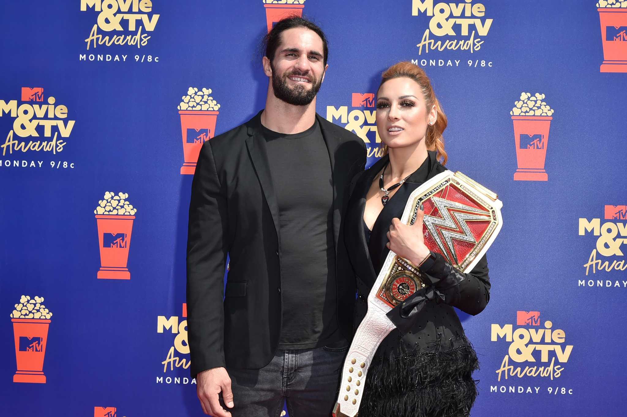 Seth Rollins and Becky Lynch attend the premiere of 'Dolittle' at