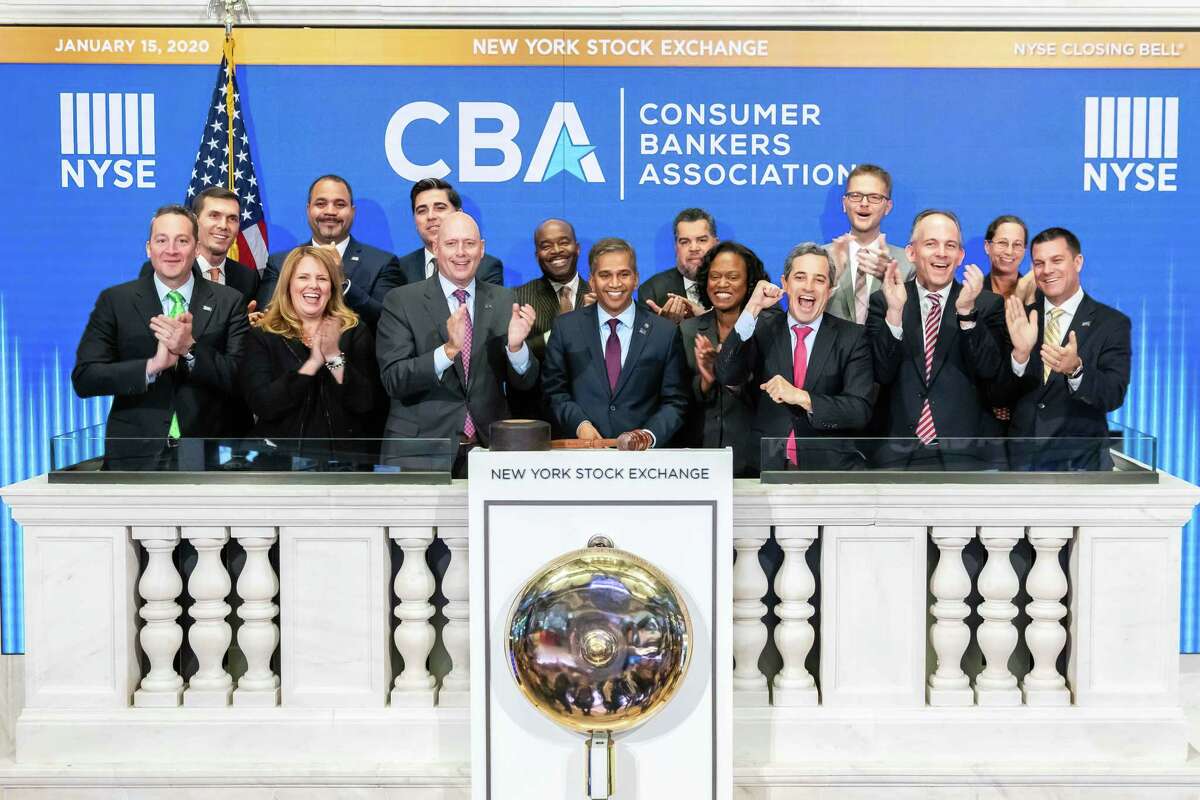 Wilton resident Nitin Mhatre, executive vice president, head of Community Banking at Webster Bank, center, rings the New York Stock Exchange’s closing bell on Jan. 15, 2020.