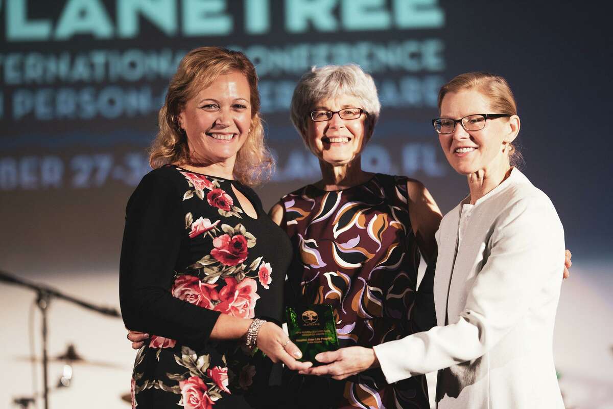 Planetree Services Supervisor at Griffin Health Laura Howell and Director Planetree Programs and Services Diane Betkoski receive The Person-Centered Care Innovation Award from Planetree International President Dr. Susan Frampton at the 2019 Planetree International Conference on Person-Centered Care.