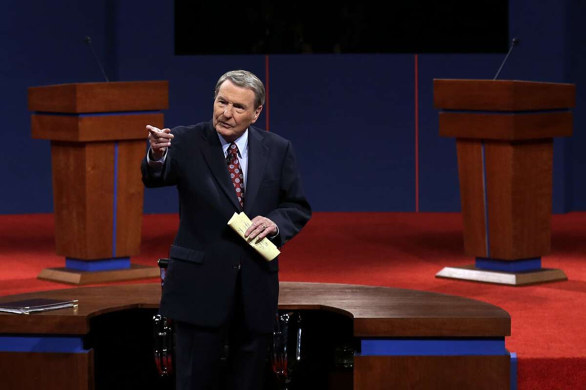 FILE - This Oct. 3, 2012 file photo shows moderator Jim Lehrer addressing the audience before the first presidential debate at the University of Denver in Denver. PBS announced that PBS NewsHour's Jim Lehrer died Thursday, Jan. 23, 2020, at home. He was 85. (AP Photo/Charlie Neibergall, File)