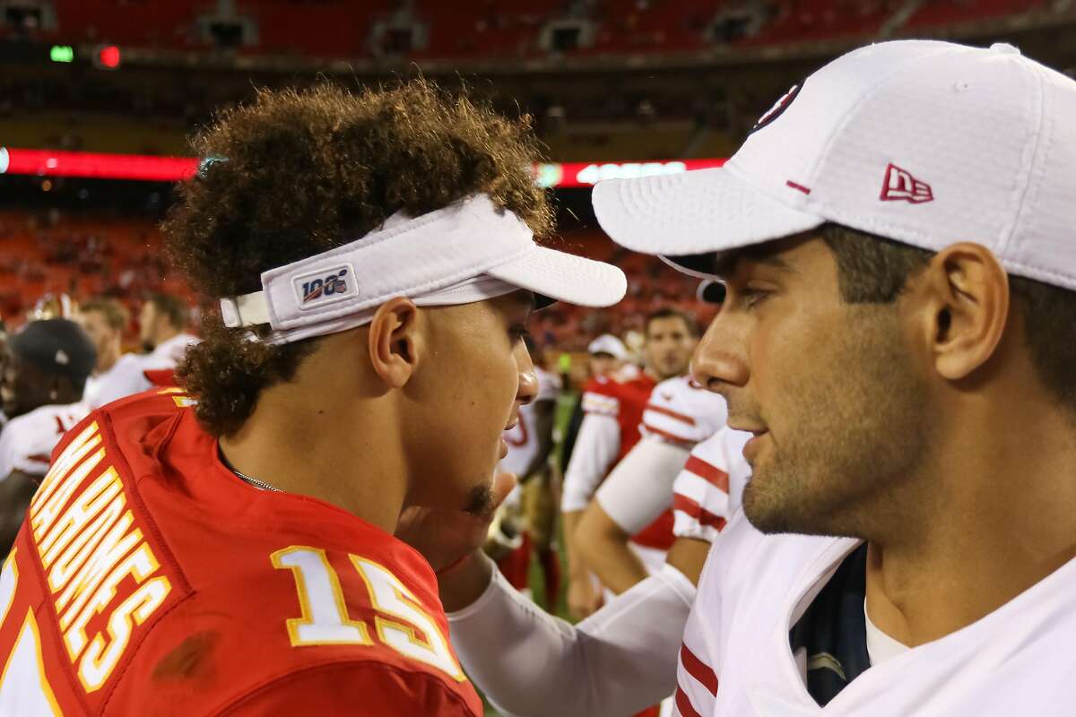 FILE - Kansas City Chiefs quarterback Patrick Mahomes (15) and San Francisco 49ers quarterback Jimmy Garoppolo (10) exchange a handshake and words after an NFL preseason game between the San Francisco 49ers and Kansas City Chiefs on August 24, 2019 at Arrowhead Stadium in Kansas City, MO.