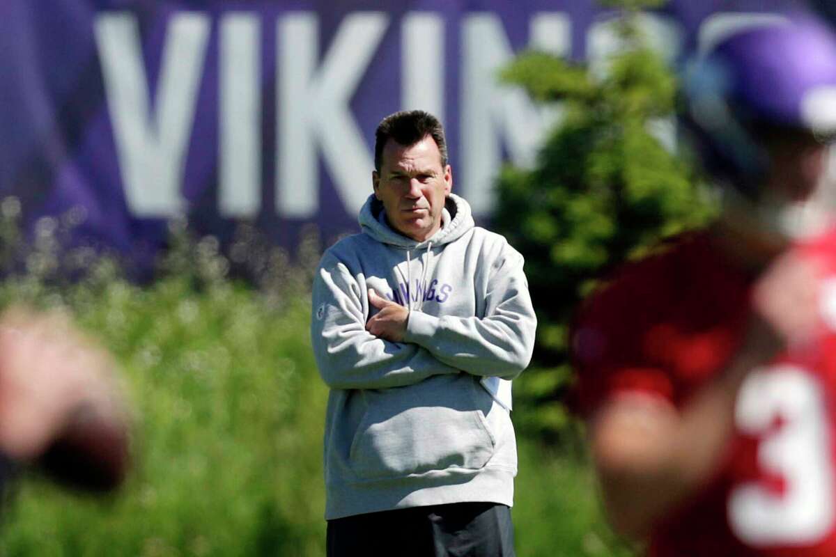 Baltimore Ravens assistant coach Gary Kubiak talks with