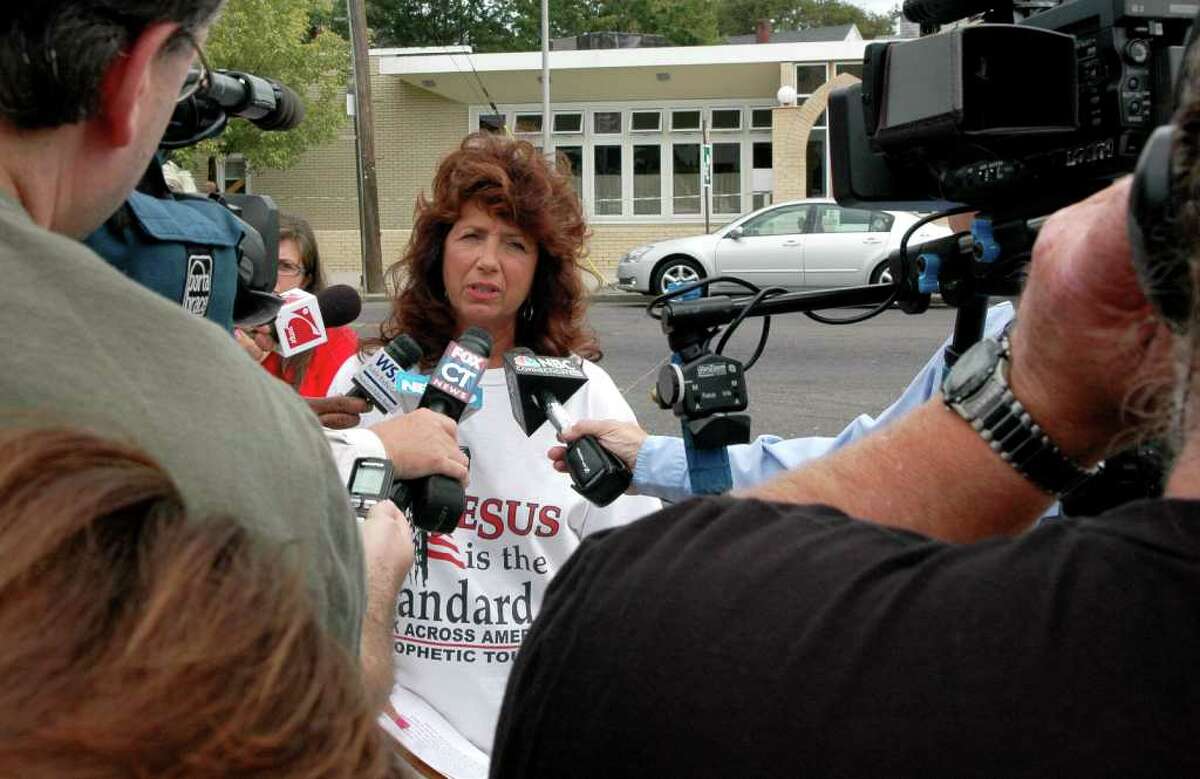 Marilyn Carroll, spokeswoman for the group Operation Save America is surrounded by media at a news conference near the Bridgeport Islamic Society on Fairfield Ave., in Bridgeport, Conn. on Friday August 13, 2010.