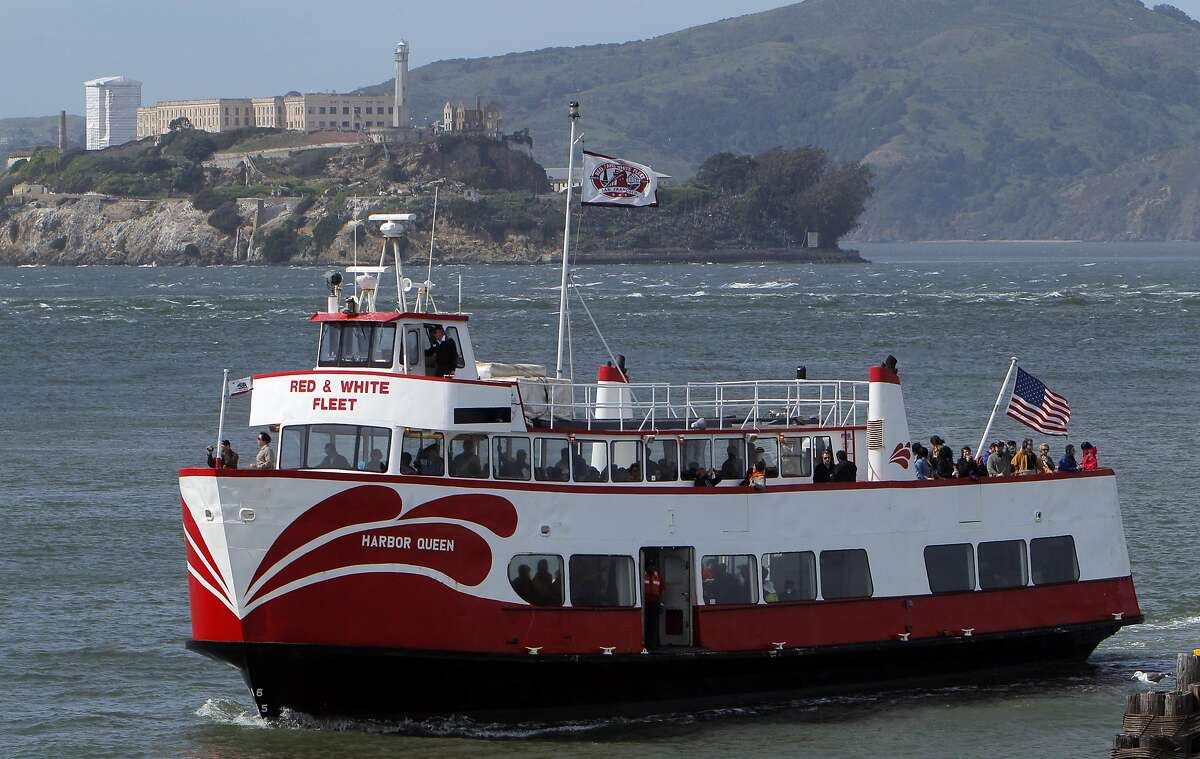 The Red and White Fleet's Harbor Queen makes its back from San Francisco Bay on Monday, April 30, 2012, with Alcatraz Island in the background. Four big events this year will make San Francisco, Calif., the hottest travel destination. The Red and White Fleet will give tourists an up front view of events like the America's Cup and the 75th anniversary of the Golden Gate Bridge.