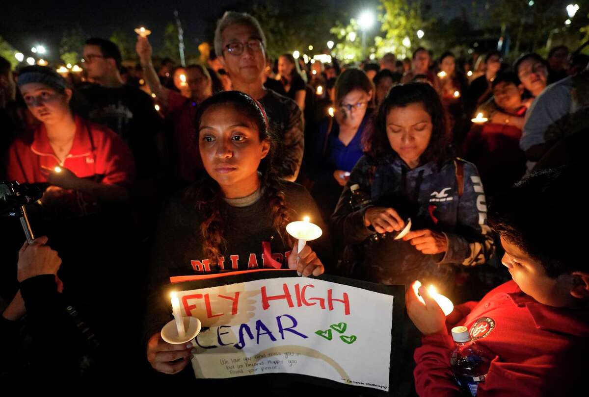 Celeste Monroy, 16, a junior at Bellaire High School, holds a sign during a vigil for her schoolmate Cesar Cortes at Evelyn's Park in Bellaire Wednesday, Jan. 15, 2020. Cesar Cortes, 19, a Bellaire High School senior, died after being shot at the school yesterday. Cortes was killed in what officials described as an accidental shooting on campus by a fellow JROTC classmate.