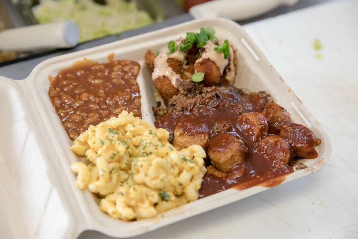 The Vegan Mob Combo Plate, with smoked plant-based brisket, barbecue shrimp and beyond sausage with vegan mac and cheese and barbecue baked beans.