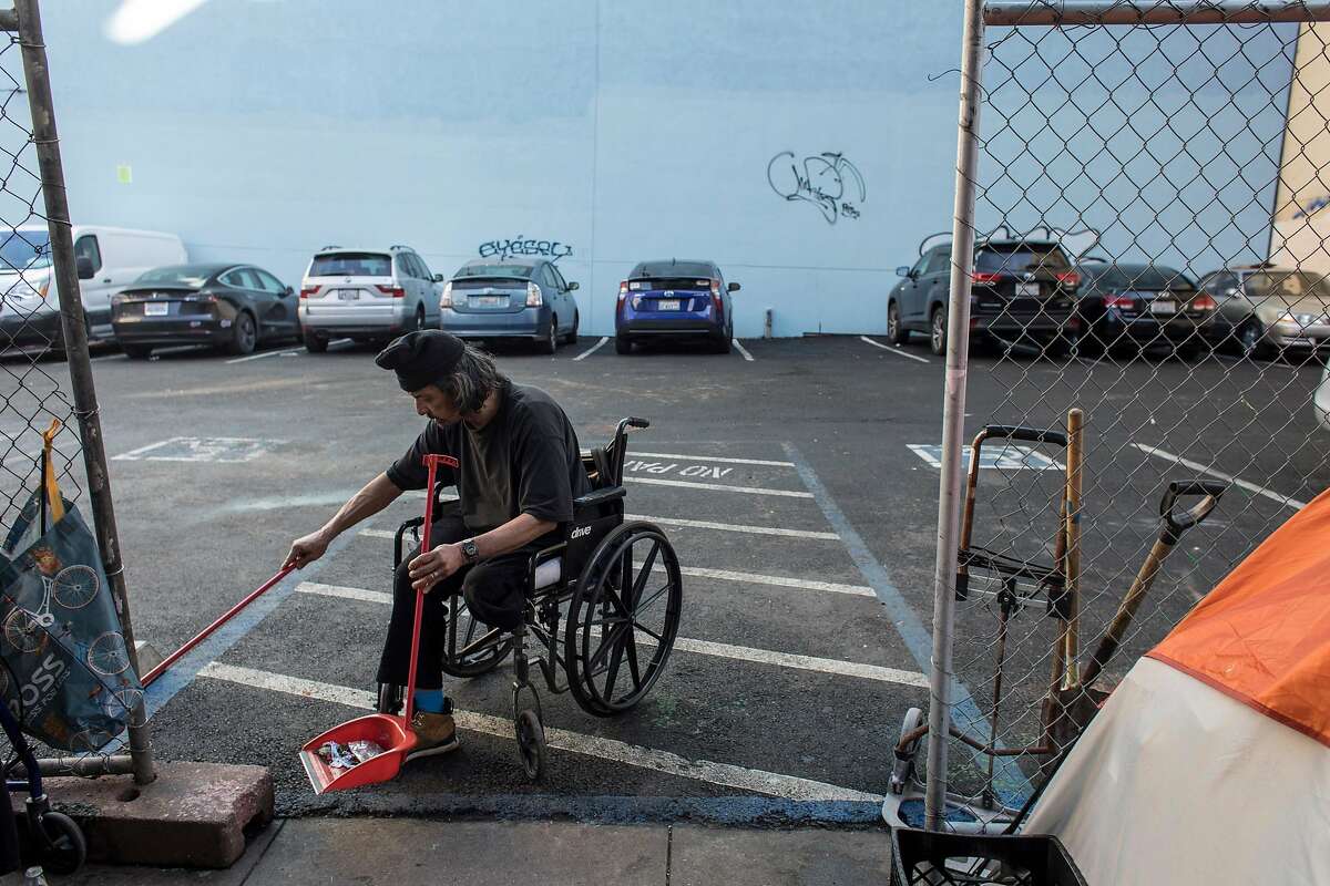 Michael Hwang, 67, sweeps the parking lot at Jones and Turk Streets on Wednesday, Jan. 22, 2020 in San Francisco, Calif. The city of San Francisco rejected a proposal to build tiny units for the homeless on a parking lot at 180 Jones Street.