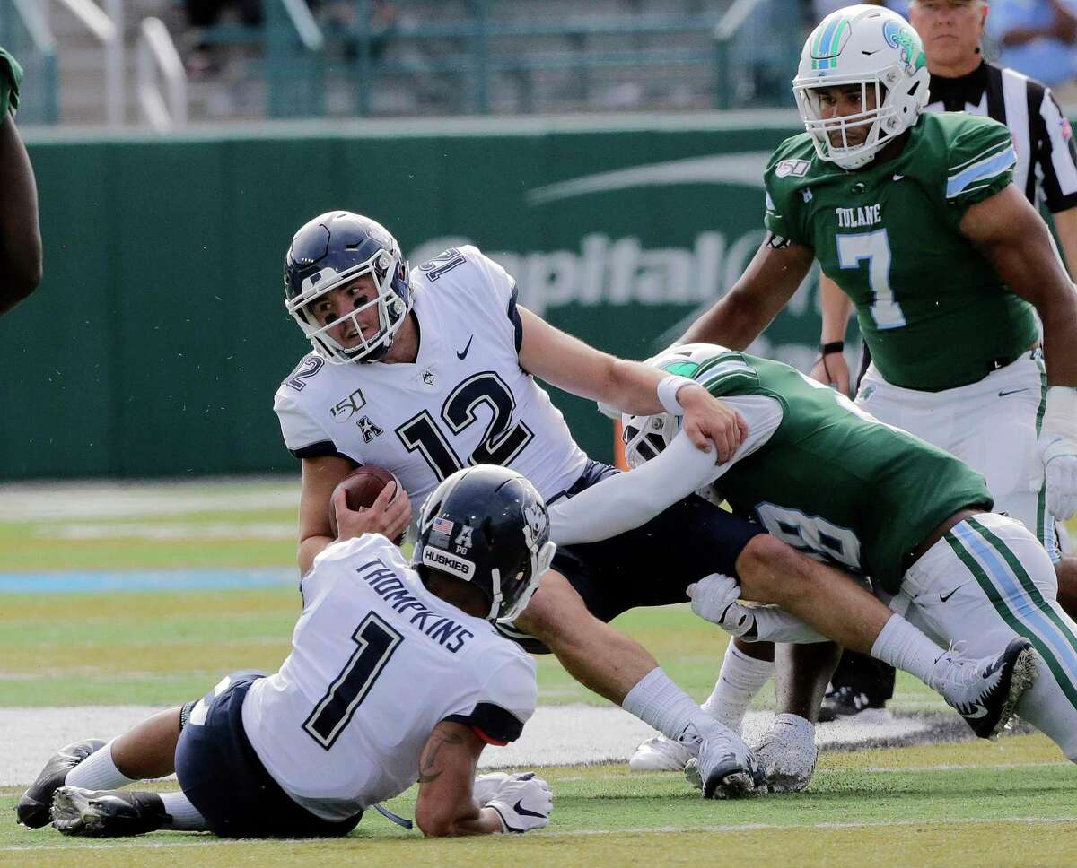 Connecticut quarterback Mike Beaudry gets sacked by Tulane linebacker Marvin Moody during an NCAA college football game Oct. 12, 2019, in New Orleans.