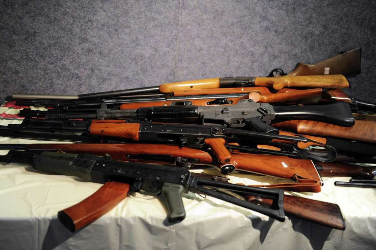 In a file photo, Rifles, including an AK-47, were turned in during a gun buyback event at the Bridgeport Police Department.